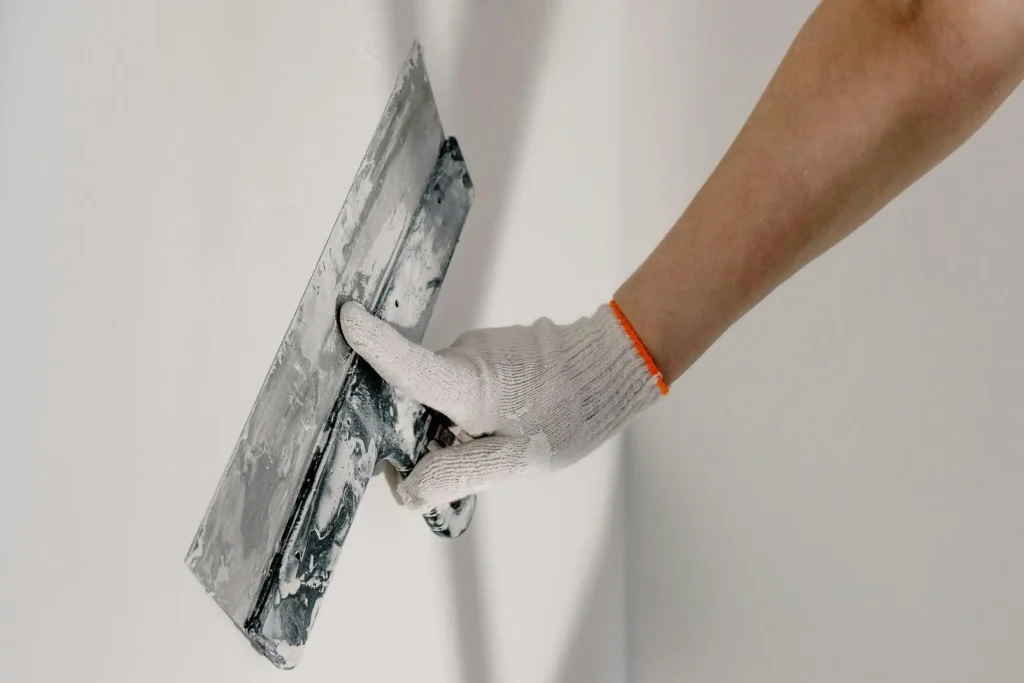 a-man-preparing-wall-for-painting