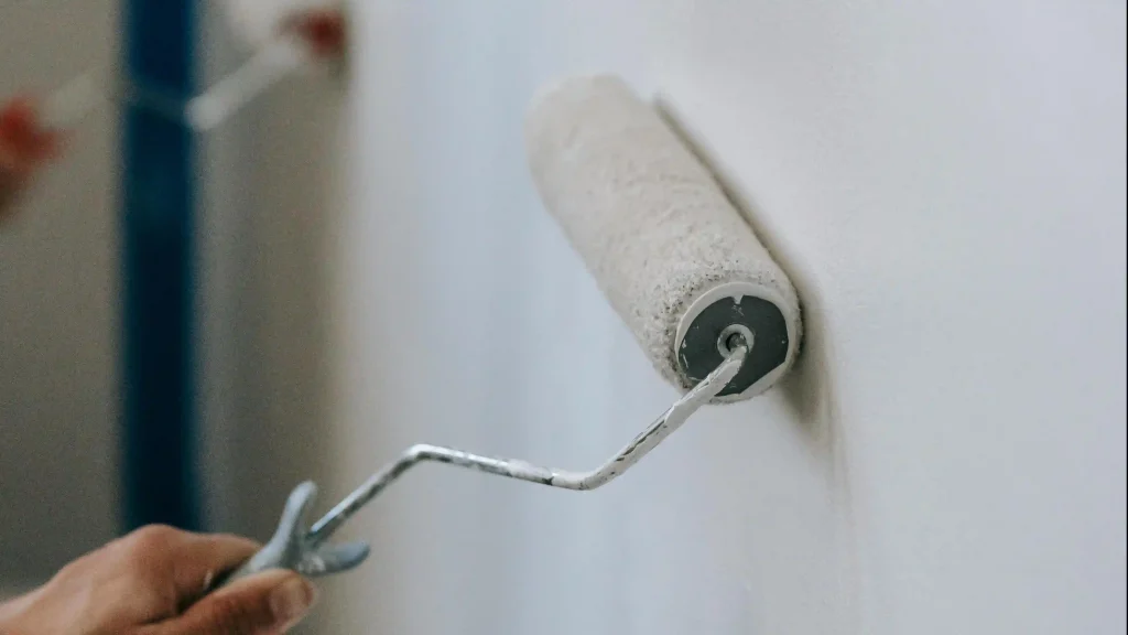 a-person-painting-wall