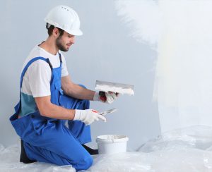 a-man-applying-gypsum-plaster