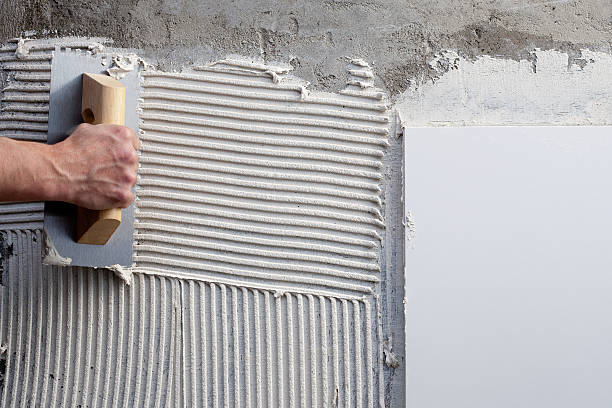 Use a trowel with white cement mortar for tile installation